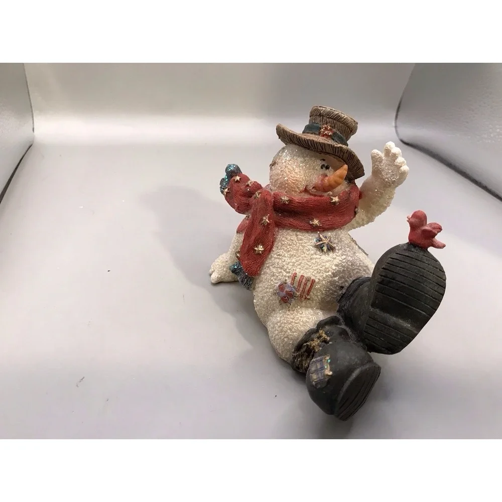 Resin Snowman Kicked‎ Back With A Bird On His Foot